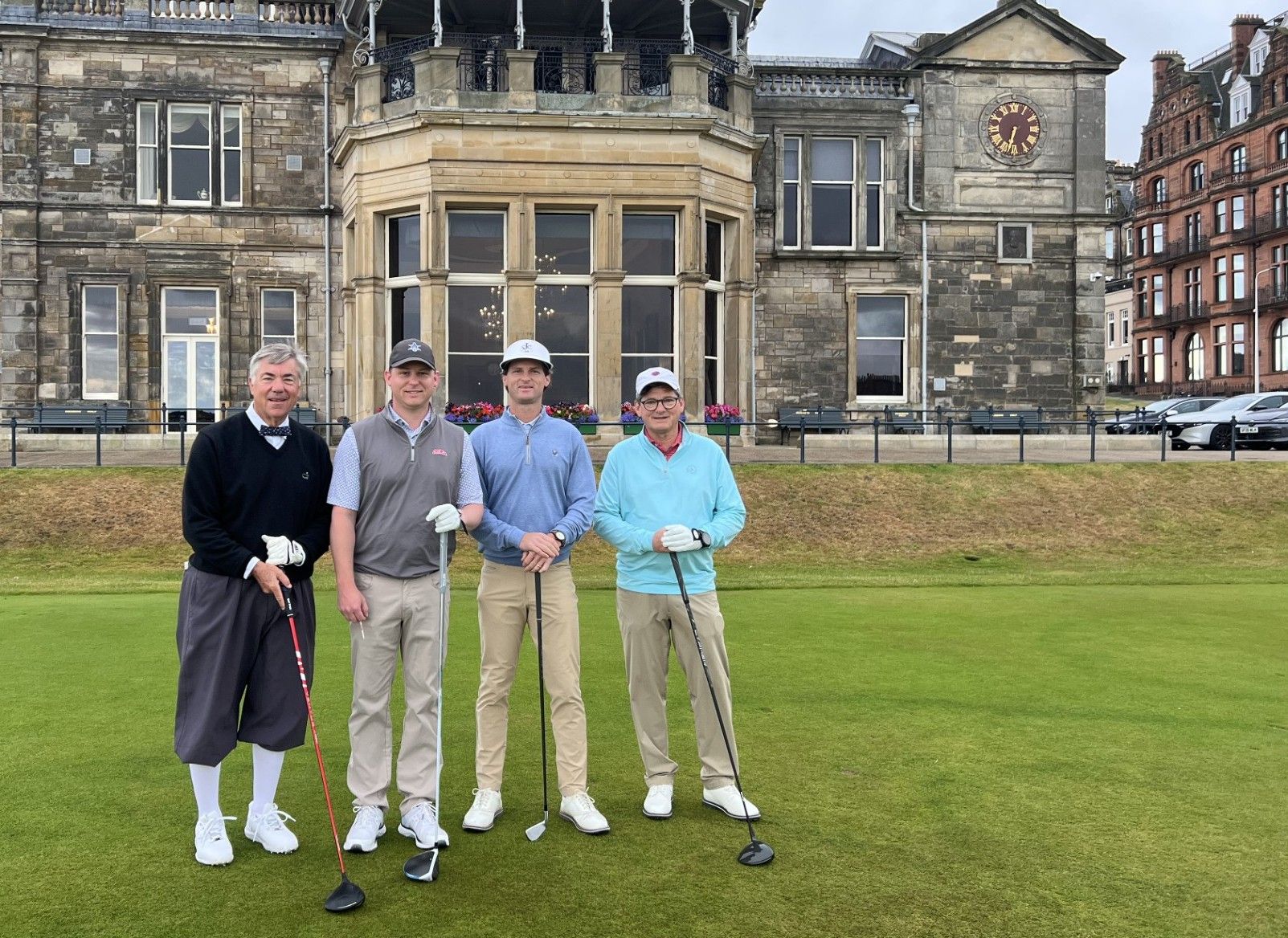 Jim Gulley with three golfers on the first tee of the Old Course at St. Andrews, 2026